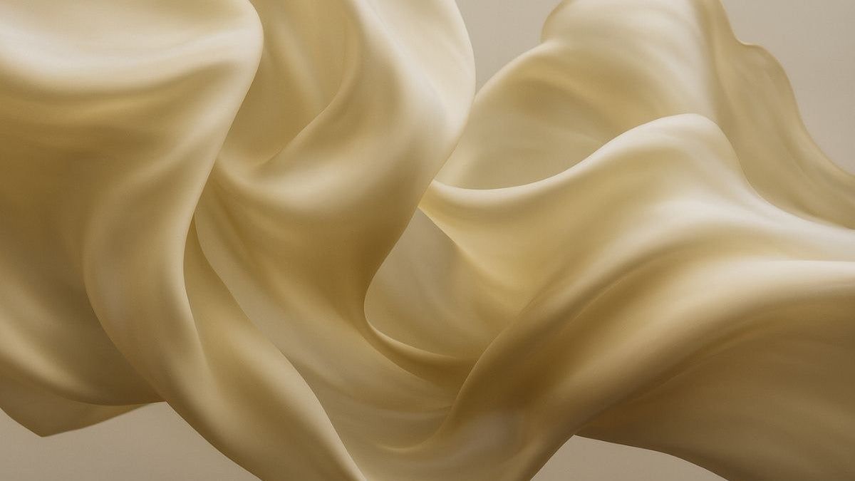 champagne color silk fabric in midair