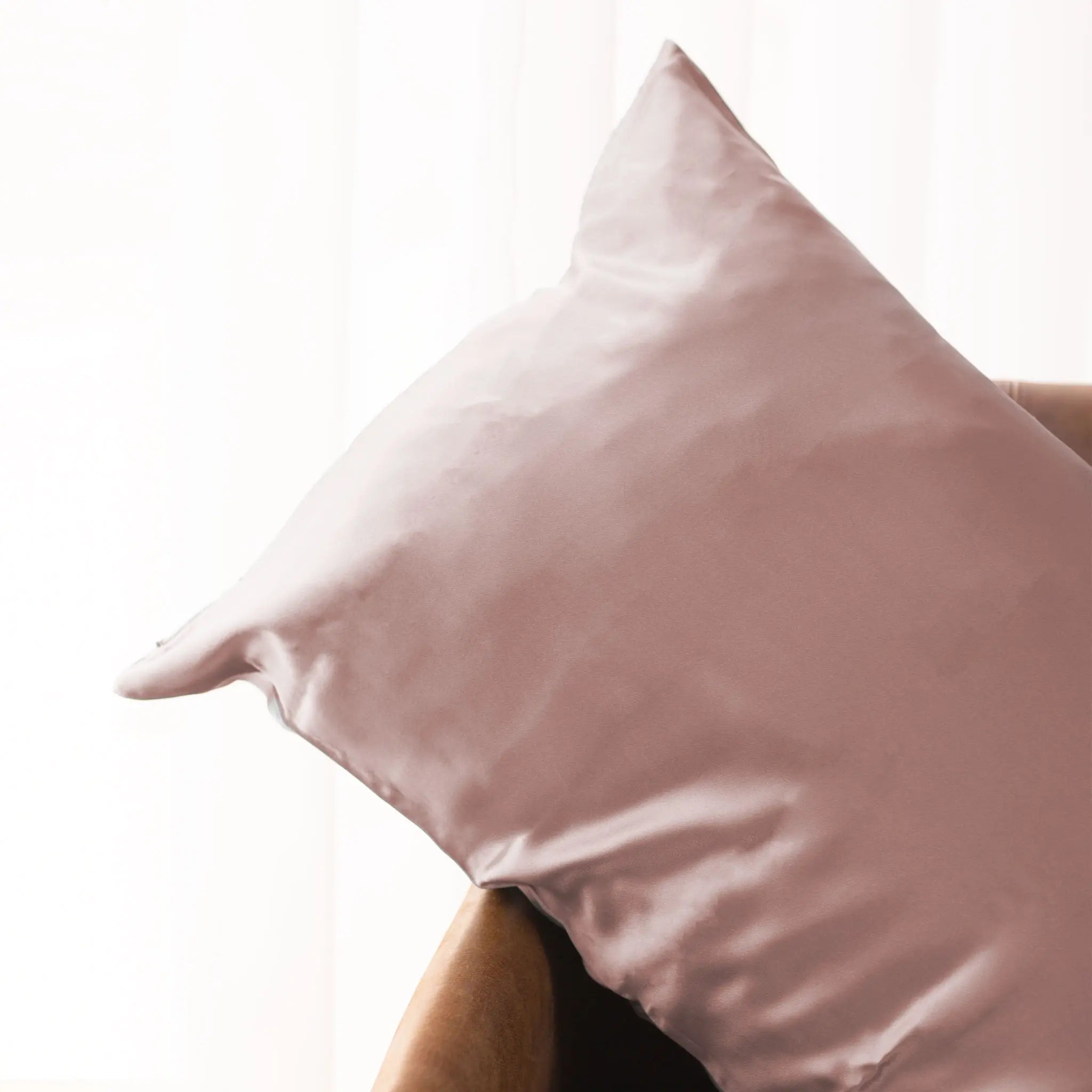 Pillow with Soft Blush silk pillowcase on a white background — Silk Souq pure mulberry silk home decor.