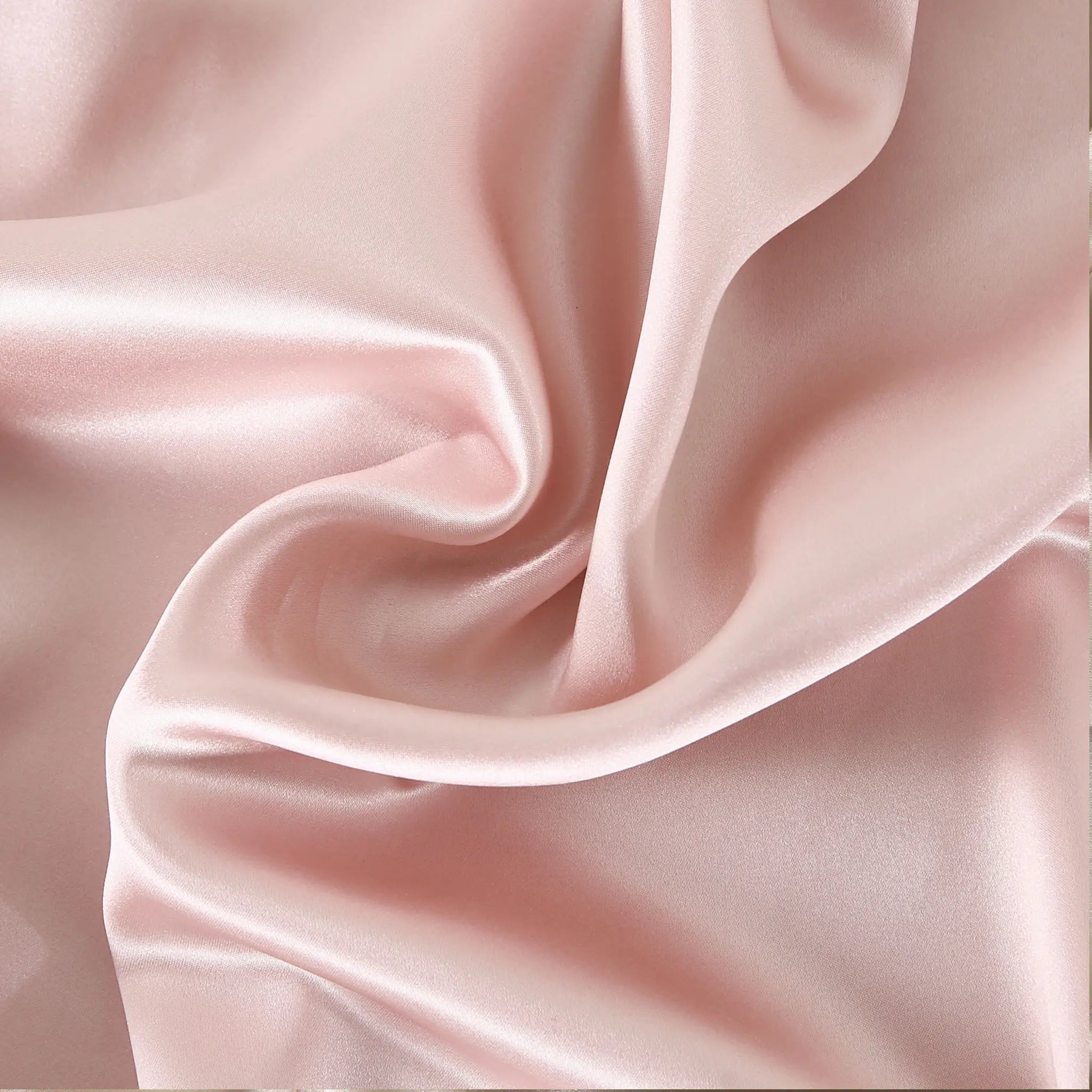 Soft Blush mulberry silk fabric close-up — smooth 22 momme silk with natural sheen and soft texture.