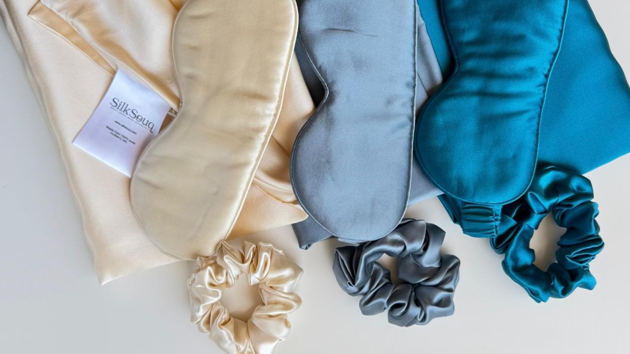 Thoughtful Ramadan gift sets of mulberry silk sleep masks and scrunchies in beige, gray, and blue on a light background.Thoughtful Ramadan gift sets of mulberry silk sleep masks and scrunchies in beige, gray, and blue on a light background.